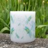 Pillar candle with picture of dragonfly.