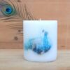 Pillar candle with a Peacock picture.