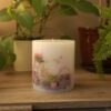 Pillar candle with a picture of Bike and Flowers.