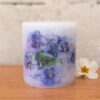 Pillar candle with a picture of Blue Pansies.