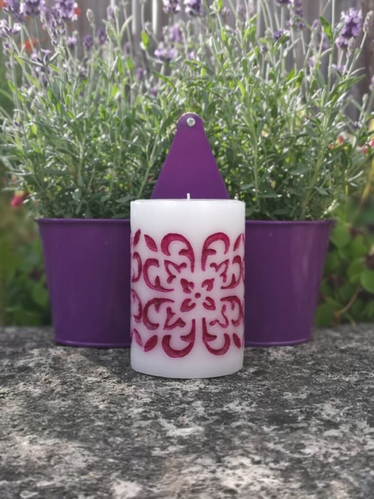 Medium pillar candle - hand carved and hand painted with purple wax