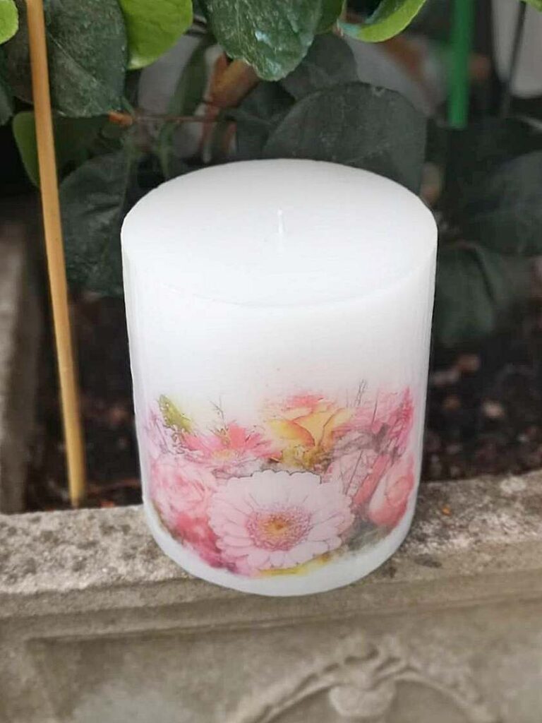 Pillar candle with a Pink Gerbera picture.