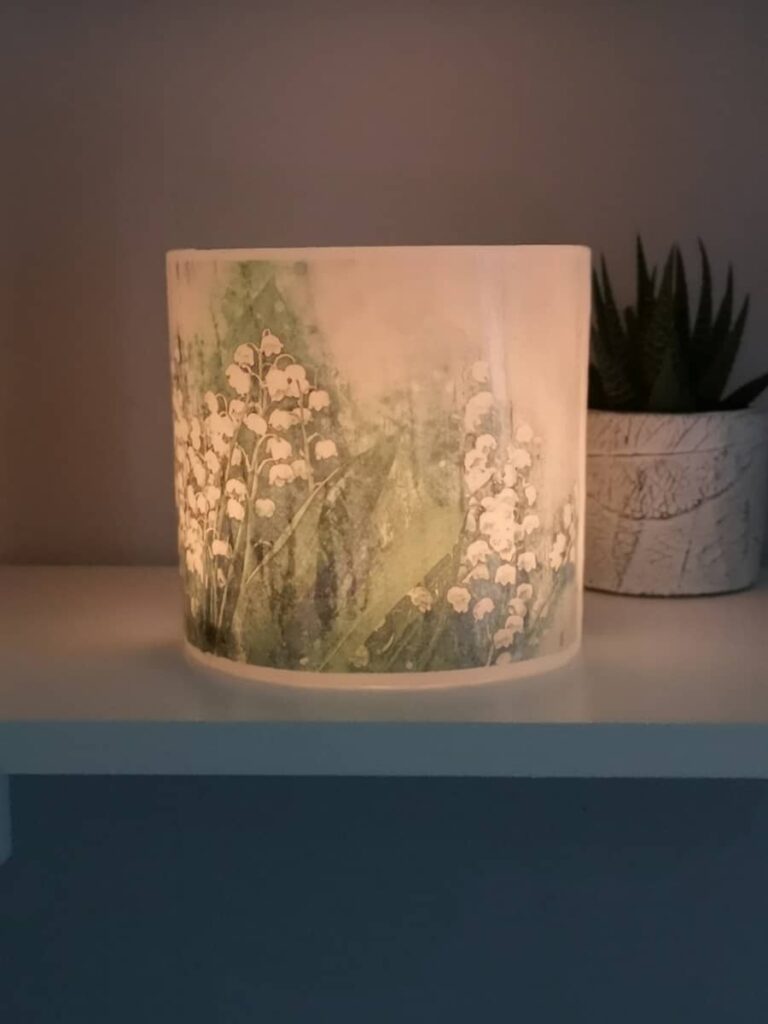 Lantern with an image of the Lily of the Valley.
