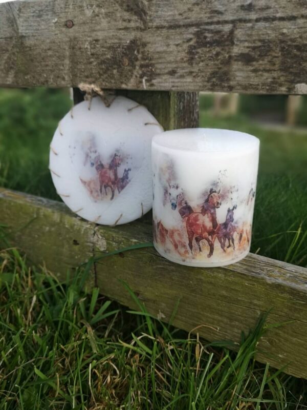 Wax ornament and a large pillar candle candle with a picture of Horses.