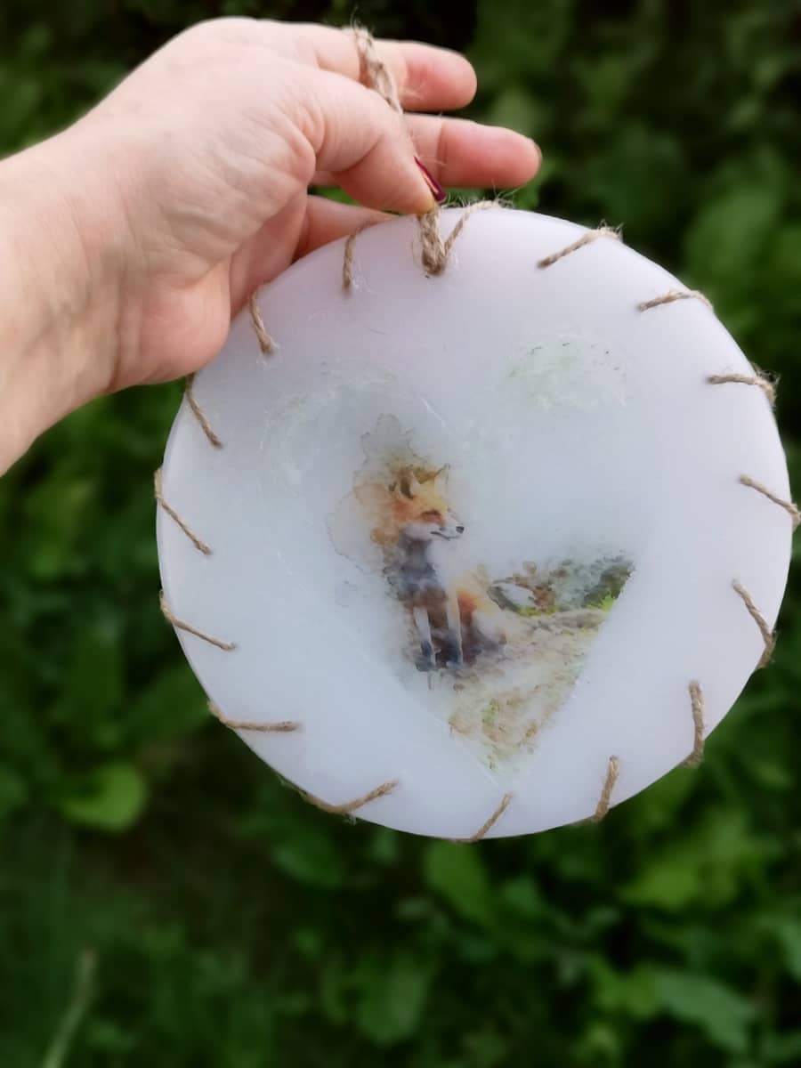 Round wax wall decoration with an image of Fox.