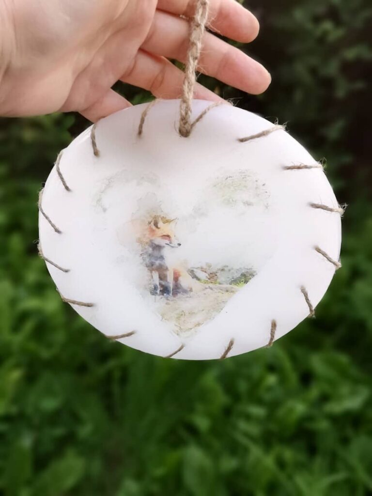 Round wax wall decoration with image of Fox