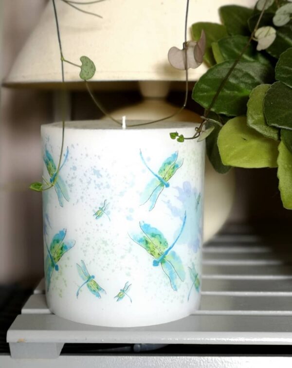 Pillar candle with picture of dragonfly.