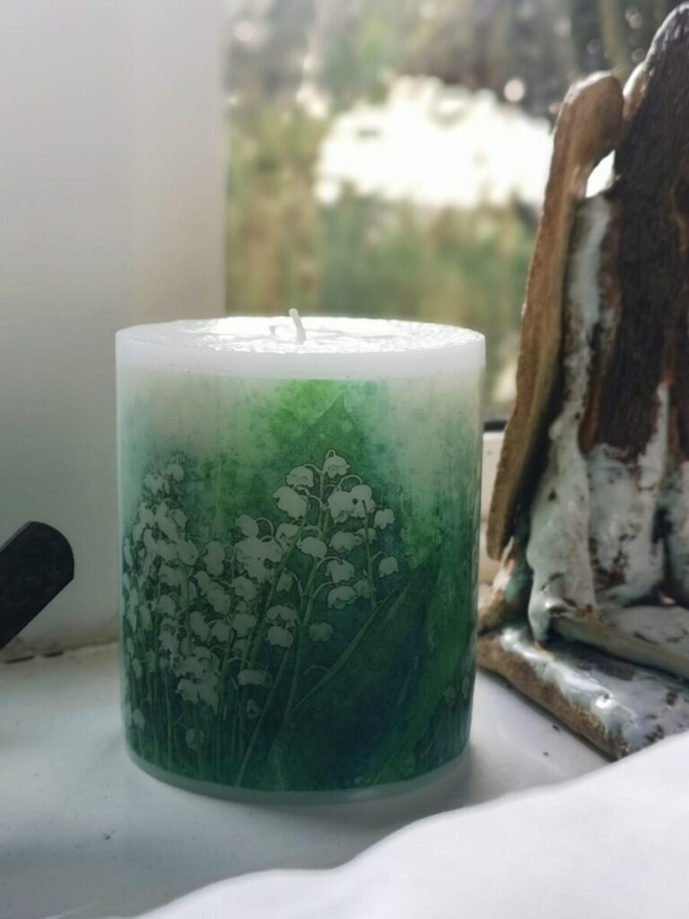 Pillar candle with a picture of Lily of the Valley