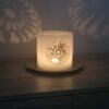 Wax lantern with ivory crochet doilies, embroidered with tiny beads.