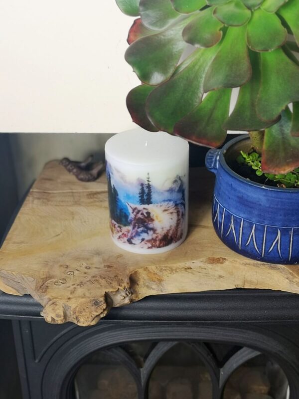 Pillar candle with a wolf image.