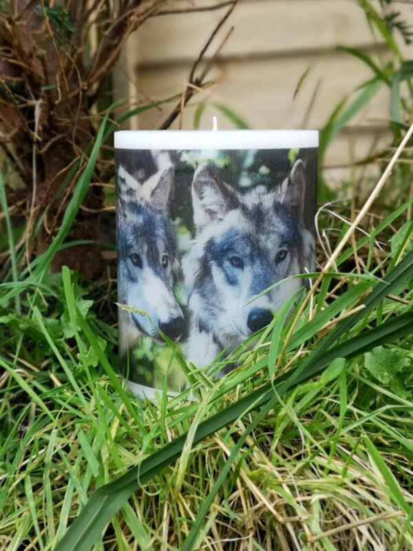 Pillar photo candle with images of wolves.