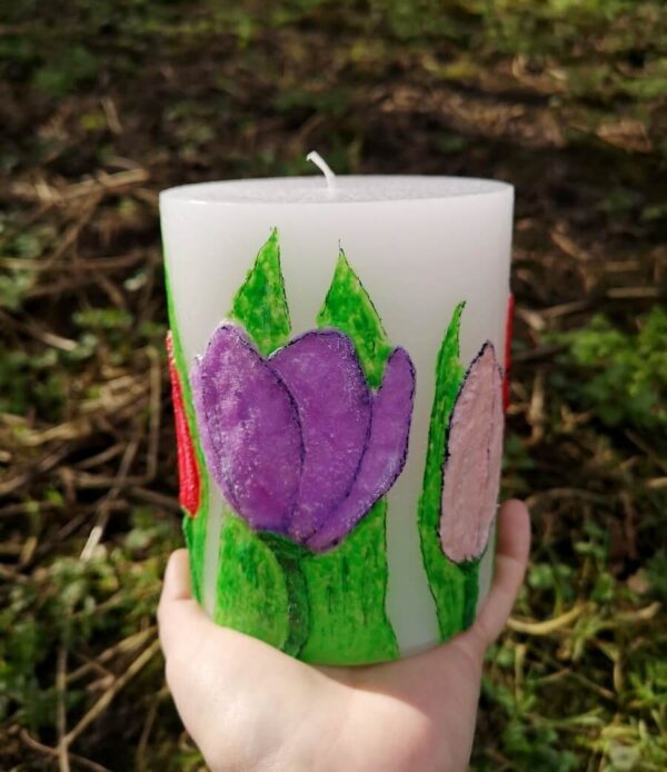 Large pillar candle with felt tulips.