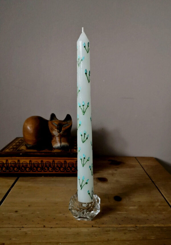 The one of 3 taper candles with blue flowers pattern.