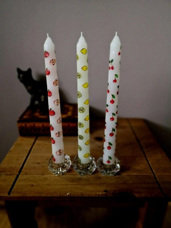 The set of 3 taper candles with fruit pattern.