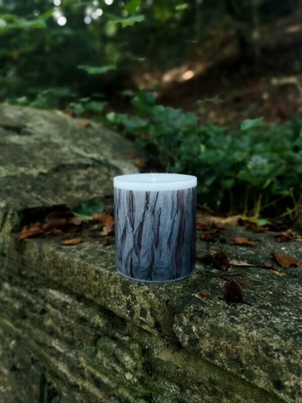 Large candle with printed Cedar bark tree pattern.