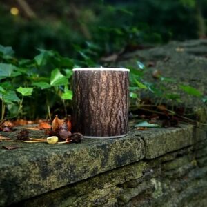 Large candle with printed Oak bark tree pattern.