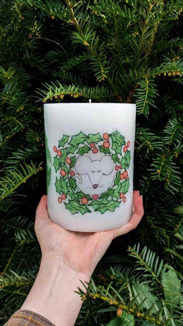 Pillar festive candle with a sleeping mouse image.