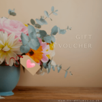 Gift voucher with a picture of bunch of flowers.